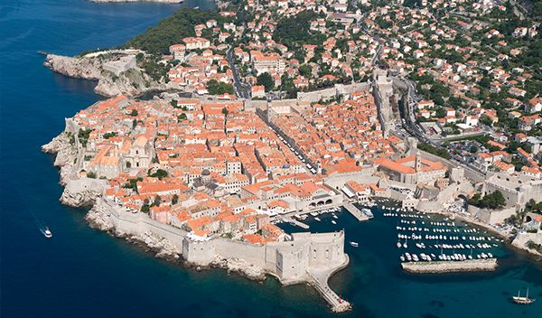 Stone walkway on top of the Dubrovnik City Walls with the Adriatic Sea in the background